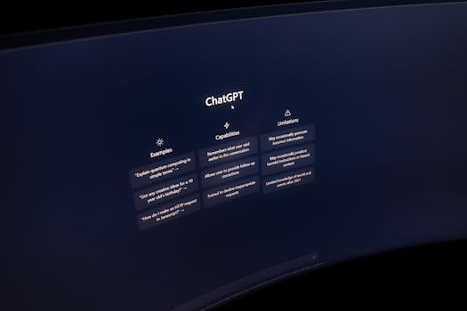 Close-up of a computer screen displaying ChatGPT interface in a dark setting.